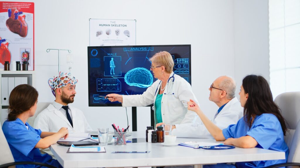 Senior woman neurologist analysing brain functions using high tech