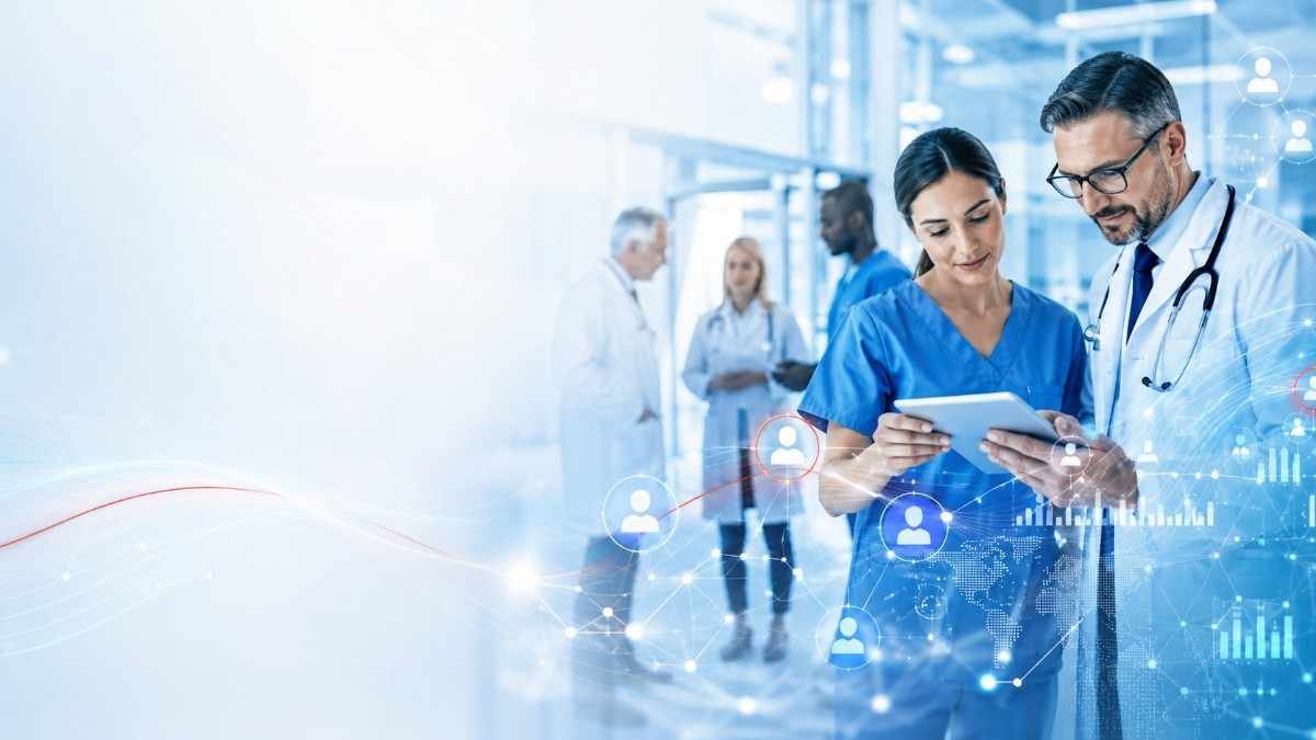 Doctor and nurse reviewing healthcare contact data on a tablet